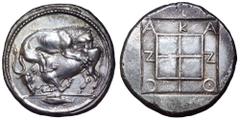 Macedon, Akanthos AR Tetradrachm. Circa 470-430 BC. Lion right, attacking bull crouching left; in exergue, fish left / AKANΘION in shallow incuse around quadripartite square, the quarters raised and g