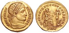 Constantine I AV Solidus. Ticinum, AD 324. CONSTANTINVS P F AVG, laureate bust right / VICTORIB AVGG ET CAESS NN, Victory seated right on cuirass and shield, holding shield inscribed VOT XX, trophy an