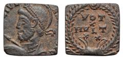 Roman Gaming Token (?), cut from a Julian II Æ Nummus. Uncertain mint, AD 361-363. [D N FL CL] IVL[IANVS P F AVG], diademed, helmeted and cuirassed bust left, holding spear and shield / VOT X MVLT XX 