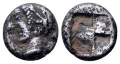 Ionia, Phokaia AR Tetartemorion. Circa 521-478 BC. Phokaic standard. Head of nymph left, wearing sakkos and earring / Quadripartite incuse punch. SNG Kayhan 524. 0.15g, 9mm. Good Fine. Porous. Scarce.