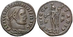 Roman Imperial Constantine I, as Filius Augustorum, Æ Nummus. Alexandria, AD 309-310. FL VAL CONSTANTINVS FIL AVG, laureate head right / GENIO CAESARIS, Genius standing facing, head left, holding pate