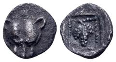 Greek Thraco-Macedonian Region AR Hemiobol. Uncertain mint, 5th century BC. Lion's head facing / Grape bunch within pelleted border within incuse square. Tzamalis 56. 0.21g, 6mm, 6h. Good Very Fine.