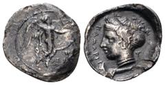 Greek Sicily, Kamarina AR Hemidrachm. Circa 415-410 BC. Nike flying right with shield, olive branch in front / KAMAPIN[A], head of a nymph left; A behind, two fishes below. Westermark & Jenkins 169; A