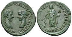 Roman Provincial Macrinus and Diadumenian Æ28 of Marcianopolis, Moesia Inferior. AD 217-218. Confronted busts of Macrinus, laureate, and Diadumenian, bare-headed / Asklepios standing facing head right