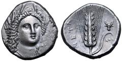 Greek Lucania, Metapontion AR Stater. Circa 330-290 BC. Atha-, magistrate. Head of Demeter, wearing grain wreath, facing slightly right / Ear of barley ear with leaf to right; bukranion above leaf, AΘ