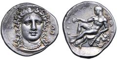 Greek Bruttium, Kroton AR Stater. Circa 400-325 BC. Head of Hera Lakinia facing slightly right, wearing necklace and polos decorated with palmettes; B to right / Young Herakles, nude, holding cup in e