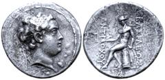 Greek Seleukid Empire, Antiochos the son of Seleukos IV AR Tetradrachm. Antioch, circa 175 BC. Diademed head right / Apollo Delphios seated left on omphalos, holding arrow and resting on hand on bow; 