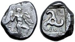 Greek Dynasts of Lycia, Kuprilli AR Stater. Telmessos, circa 480-440 BC. Winged male figure, nude, with winged heels, in kneeling stance to right, holding long kerykeion; three pellets to upper right 