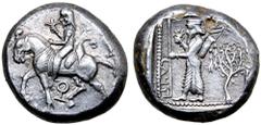 Greek Cilicia, Tarsos AR Stater. Circa 440-400 BC. Horseman (Syennesis?) riding to left, wearing kyrbasia, holding lotus flower in right hand and reins in left, bow in bowcase on saddle; Key symbol be