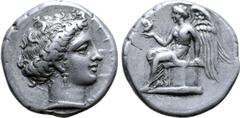 Greek Bruttium, Terina AR Stater. Circa 400-356 BC. Head of the nymph Terina right, wearing triple-pendant earring and pearl necklace; TEPINAIΩN before / Nike, wearing a long chiton and himation, sits