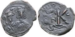 Byzantine Constantine IV Pogonatus Æ Half Nummus. Constantinople, AD 673. Helmeted facing bust, holding globus cruciger / Large K; ANNO to left, C[ON] to right; [officina letter] in exergue. Sear 1179