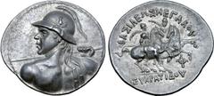 Greek Greco-Baktrian Kingdom, Eukratides I Megas AR Tetradrachm. Circa 170-145 BC. Diademed heroic bust left, seen from behind, wearing crested helmet adorned with bull's horn and ear, brandishing spe