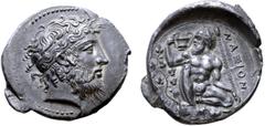 Greek Sicily, Naxos AR Tetradrachm. Circa 430-420 BC. Bearded head of Dionysos to right, wearing stephanos ornamented with ivy wreath, hair hanging in loose curly locks / Nude, bearded Silenos kneelin