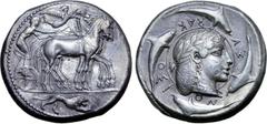Greek Sicily, Syracuse AR Tetradrachm. Deinomenid Tyranny. Time of Hieron I, circa 475-470 BC. Dies by the Demareteion Master. Charioteer wearing a long chiton and holding a goad in his right hand and