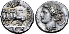 Greek Sicily, Syracuse AR Dekadrachm. Time of Dionysios I, circa 405-370 BC. Charioteer driving galloping quadriga to left, holding kentron in right hand, reins in left; above, Nike flies to right, a 