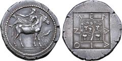 Greek Macedon, Mende AR Tetradrachm. Circa 425 BC. Dionysos, bearded and wearing himation and wreath of ivy leaves, holding kantharos in outstretched right hand wile reclining to left on the back of a