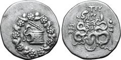Greek Mysia, Pergamon AR Cistophoric Tetradrachm. Circa 85-76 BC. Serpent emerging from cista mystica; all within ivy wreath / Two serpents entwined around bow and bowcase; TEY over monogram above, ci