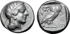 Greek Attica, Athens Fourrée Tetradrachm. Circa 405 BC. Head of Athena to right, wearing crested Attic helmet ornamented with three olive leaves above visor and spiral palmette on bowl, round earring 