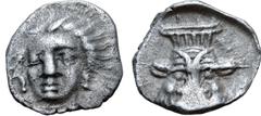 Greek Cilicia, uncertain mint AR Obol. Circa 5th-4th centuries BC. Female head facing slightly to left, circle of dots around / Head of Bes facing, within shallow incuse. SNG Levante 233; SNG BnF 486;