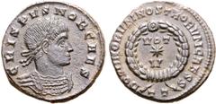 Roman Imperial Crispus, as Caesar, BI Nummus. Ticinum, AD 320. CRISPVS NOB CAES, laureate and cuirassed bust to right / DOMINORVM NOSTRORVM CAESS, VOT V in two lines within wreath; star between lines;