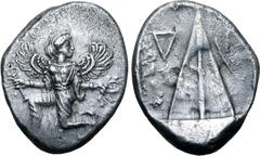 Greek Karia, Kaunos AR Stater. Circa 430-410 BC. Iris running to left, head reverted, holding kerykeion in right hand and wreath in left / Triangular baetyl, inverted Δ and Γ across upper fields; all 
