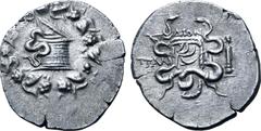 Greek Lydia, Tralleis AR Cistophoric Tetradrachm. Circa 140-135 BC. Dion-, magistrate. Serpent emerging from cista mystica; all within ivy wreath / Two serpents entwined around bow and bowcase; ΔION a
