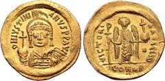 Byzantine Justinian I AV Solidus. Constantinople, AD 545-565. D N IVSTINIANVS P P AVC, helmeted and cuirassed bust facing, holding globus cruciger and shield decorated with horseman motif / VICTORIA A