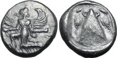 Greek Karia, Kaunos AR Stater. Circa 430-410 BC. Iris running to left, head reverted, holding a kerykeion in right hand and a wreath in left / Triangular baetyl with handle on either side of the apex,