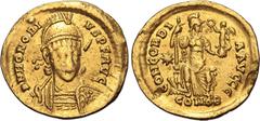 Maritime Honorius AV Solidus. Constantinople, AD 408-420. D N HONORIVS P F AVG, helmeted, pearl-diademed, draped and cuirassed bust facing, holding spear and shield decorated with horseman motif / CON