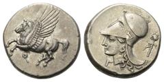 Greek Korinthia. Korinth. Stater (Silber). Ca. 345 - 307 v. Chr. Vs: Pegasos nach links fliegend, darunter Koppa. Rs: Kopf der Athena korinthischem Helm links; im Feld rechts Thyrsos. 21 mm. 8,50 g. S