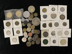 World Coins World Tokens, a group of approximately 54 tokens, consists of several interesting pieces, namely, Hong Kong, The Peak Tower Token, 1998, Hong Kong, Li Sheng, panda token, Hong Kong, Chungt