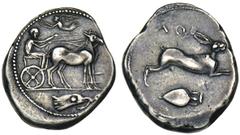 LOKROI EPIZEPHYRIOI. Bruttium. After 460 B.C. Tetradrachm. Seated driver in biga of mules r. being crowned by Nike, flying l. above, eagle's head r. below. Rv. Hare running r., overturned amphora belo