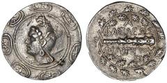 KINGS OF MACEDON. Philip V, 221-179 B.C. AR Tetradrachm. Helmeted head of the hero Perseus left, harpa over shoulder, in central boss of a Macedonian shield. Rv. Club right; above, monogram; below, tw